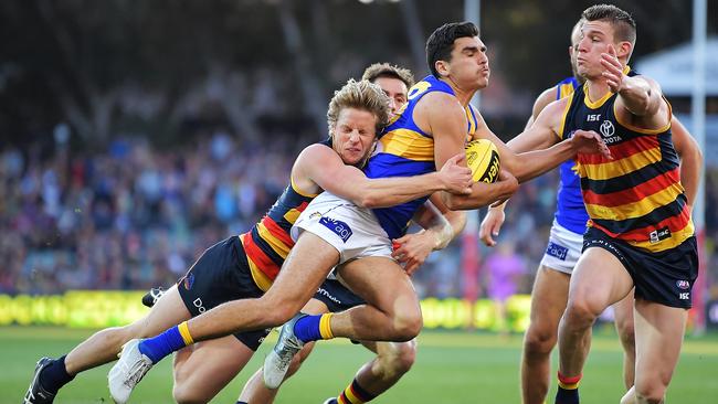 Adelaide Crows star Rory Sloane tackles West Coast’s Thomas Cole during Saturday’s clash. Picture: Daniel Kalisz/Getty Images