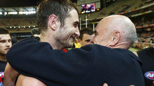 Jobe Watson and Little hugs after a Essendon win in 2013.