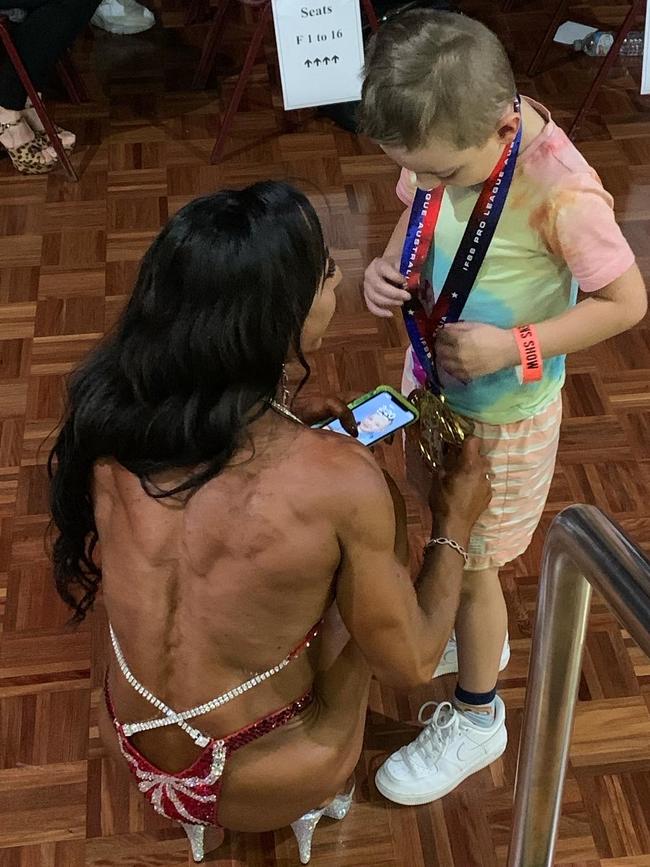 IFBB Pro Figure Champion of Australia Lisa Saygun with her son, Kye. Picture: Supplied