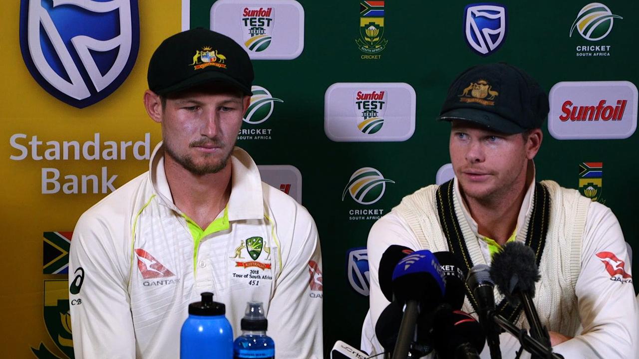 Steve Smith flanked by teammate Cameron Bancroft as the pair admitted to ball-tampering in Cape Town.