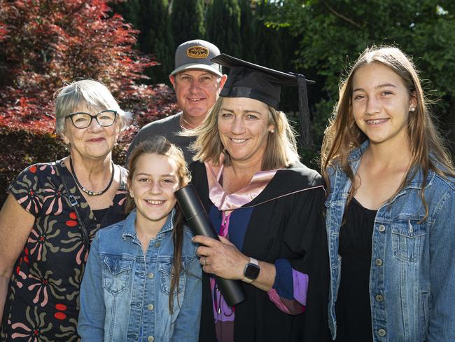 Master of Learning and Teaching (Secondary) graduate Emma Young celebrates with (from left) Jan Bonde, McKinley Young, Derek Young and Armani Young at a UniSQ graduation ceremony at The Empire, Tuesday, October 29, 2024. Picture: Kevin Farmer