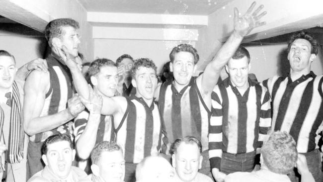 Pies celebrate in the rooms after their 18-point win.