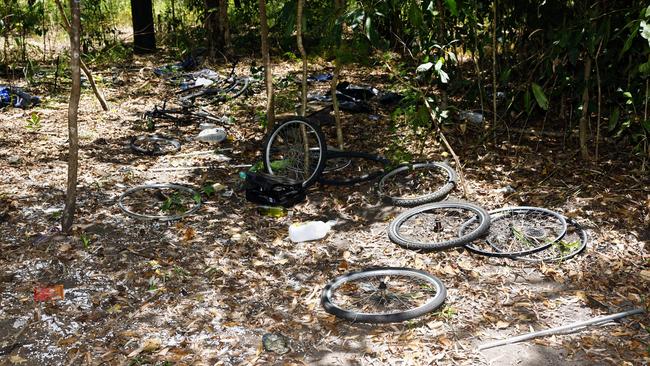 Parts from stolen bikes in a makeshift camp in the bush. Picture: Brendan Radke