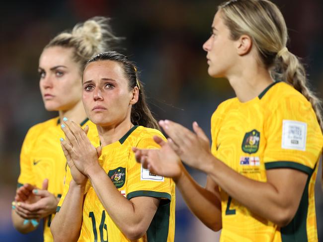SYDNEY, AUSTRALIA - AUGUST 16: Hayley Raso (C) and Australia players applaud fans after the team's 1-3 defeat and elimination from the tournament following the FIFA Women's World Cup Australia & New Zealand 2023 Semi Final match between Australia and England at Stadium Australia on August 16, 2023 in Sydney, Australia. (Photo by Brendon Thorne/Getty Images)