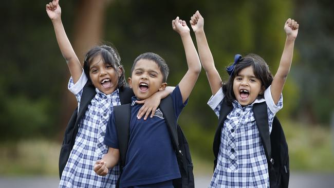 Cambridge Primary School triplets Minara, Dylan and Osara are happy to be returning to school on May 26. Picture: David Caird