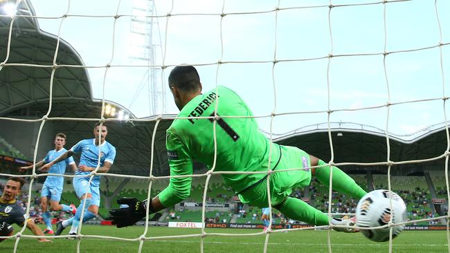 Melbourne City’s Jamie Maclaren beats Macarthur FC goalkeeper Adam Federici at AAMI Park. Picture: Getty Images.