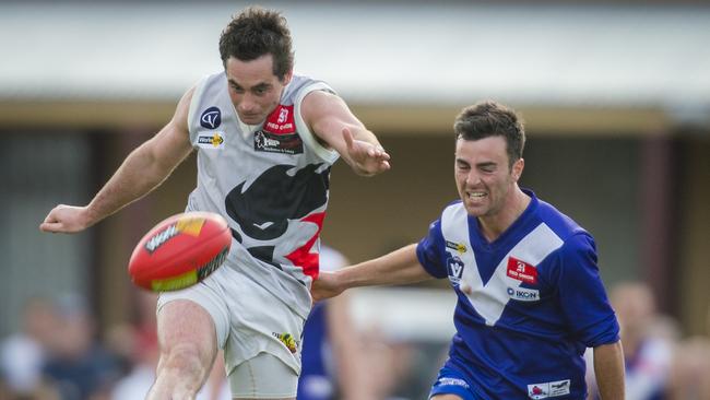 North Ballarat's Jake Hicks gets a kick away in the 2013 final. Picture: Stuart CAS Walmsley