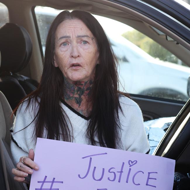 Mandy Louise Hart with her sign outside Bundaberg Court House. Picture: Liam Kidston.