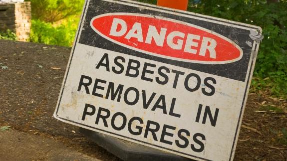 Generic asbestos removal sign outside a home containing the material. Picture: Asbestos Awareness