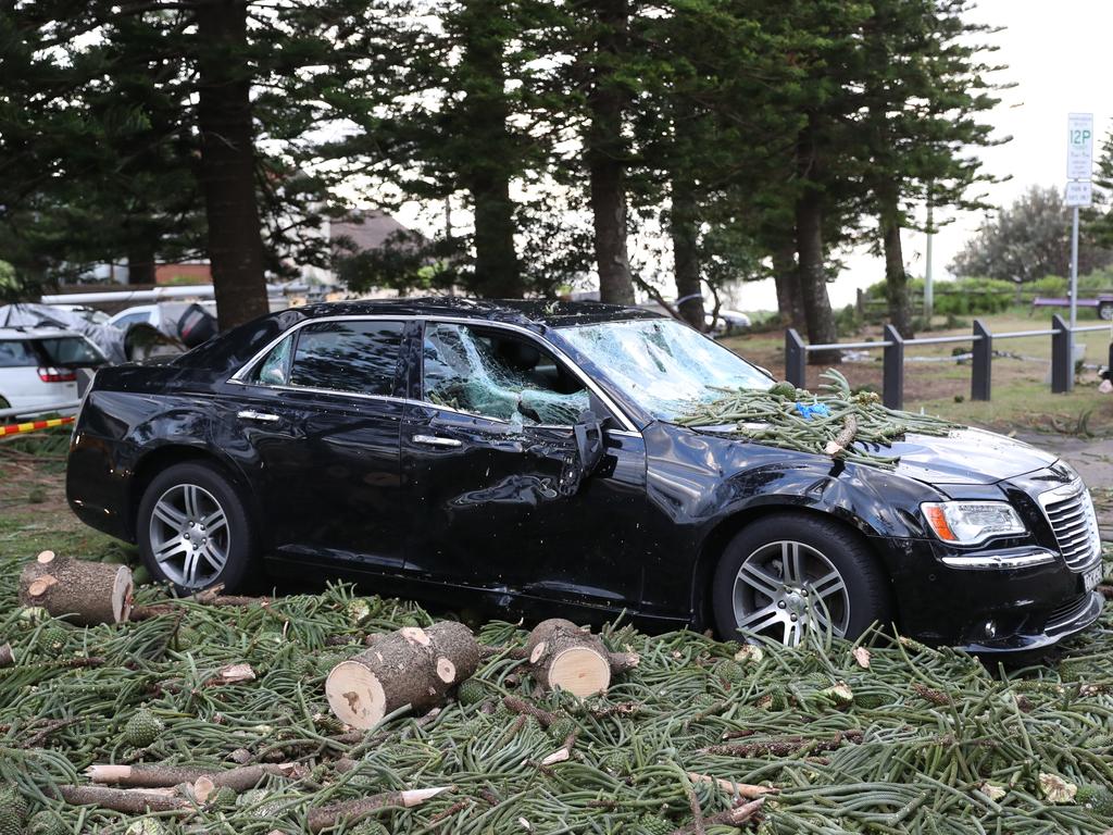 A damaged car in Narrabeen. Picture: John Grainger