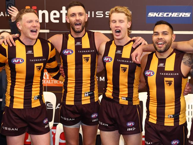 James Sicily, Jack Gunston, Cam Mackenzie and Jarman Impey celebrate the big win over Adelaide. Picture: Quinn Rooney/Getty Images