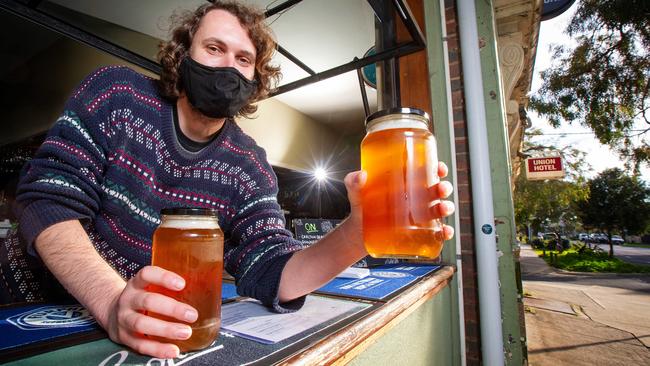 Matthew Cuthbertson serves up some jars of ale at the Union Hotel in Brunswick, which is still serving up locals. Picture: Mark Stewart