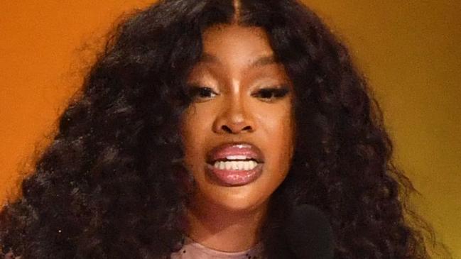 US singer SZA accepts the Best R&B Song award for "Snooze" on stage during the 66th Annual Grammy Awards at the Crypto.com Arena in Los Angeles on February 4, 2024. (Photo by Valerie Macon / AFP)