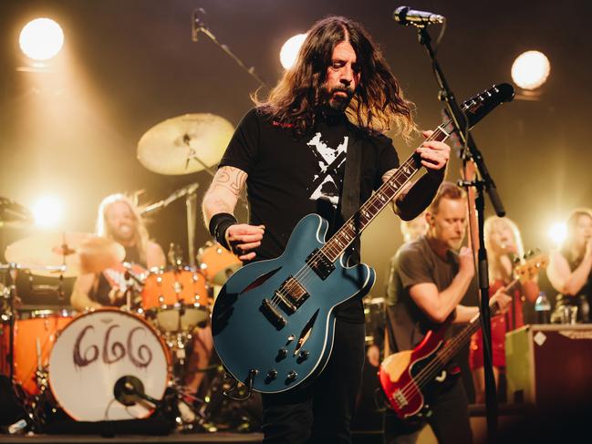 Taylor Hawkins, Dave Grohl and Nate Mendel of Foo Fighters perform onstage at the after-party for the Los Angeles premiere of Studio 666 at the Fonda Theatre on February 16. Picture: Getty Images