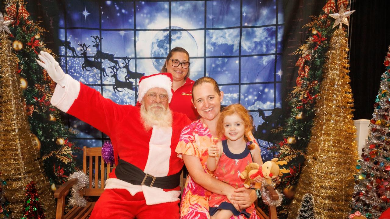 Santa at the Cairns Special Children's Christmas Party with event director Ally Young joined by Alison and Annabelle Armistead. Picture: Colyn Huber