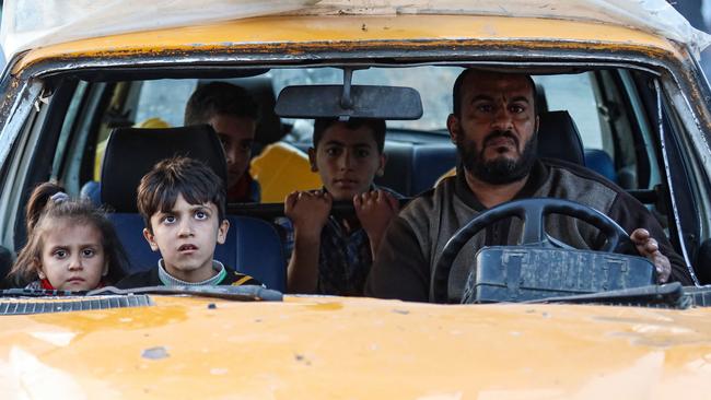 Residents of the refugee camp of Bureij arrive in Deir al-Balah in the central Gaza Strip following an evacuation order, on December 22. Picture: AFP