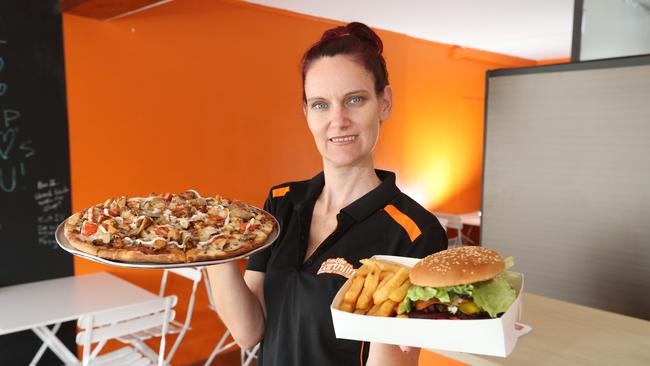 Owner Teaki Page with a New Orleans Pizza and Burger with the lot. Picture: Richard Gosling