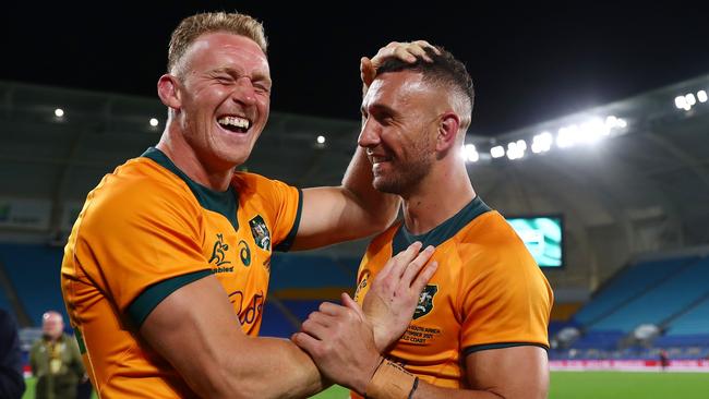 GOLD COAST, AUSTRALIA - SEPTEMBER 12: Reece Hodge and Quade Cooper of the Wallabies celebrate winning the Rugby Championship match between the South Africa Springboks and the Australian Wallabies at Cbus Super Stadium on September 12, 2021 in Gold Coast, Australia. (Photo by Chris Hyde/Getty Images)