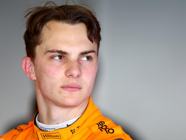 ABU DHABI, UNITED ARAB EMIRATES - NOVEMBER 22: Oscar Piastri of Australia and McLaren looks on in the garage during Formula 1 testing at Yas Marina Circuit on November 22, 2022 in Abu Dhabi, United Arab Emirates. (Photo by Mark Thompson/Getty Images)
