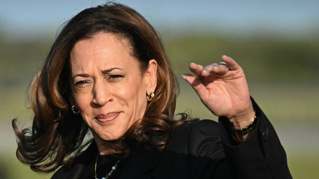 Vice President Harris waves as she arrives at Philadelphia International Airport. Photo by Jim Watson / AFP