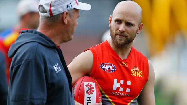 Gary Ablett talks with coach Rodney Eade.