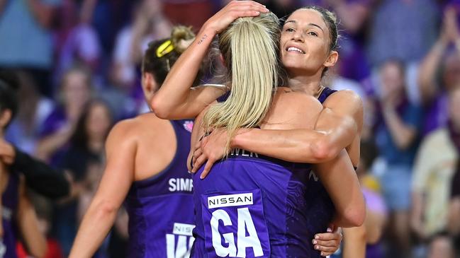 Kim Ravaillion celebrates with Mia Stower after helping the Firebirds notch their first win of the season against the Giants. Photo: Getty Images