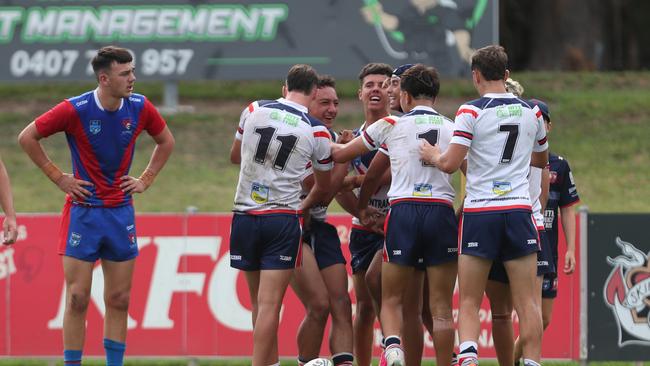 The Roosters celebrate a try. Picture: Sue Graham