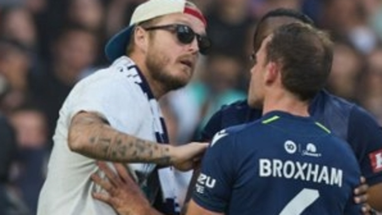 A rogue fan confronts to Victory player Leigh Broxham. Picture: Supplied Victoria Police,