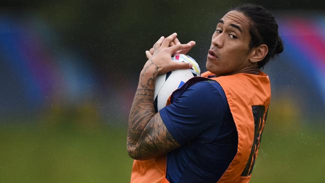 Australia's wing Joe Tomane takes part in an Australia team training session on September 21, 2015 at the University of Bath, south west England, ahead of their opening Rugby World Cup 2015 match against Fiji on Wednesday. AFP PHOTO / MARTIN BUREAU RESTRICTED TO EDITORIAL USE