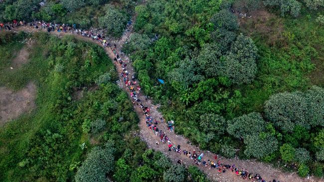 Migrants walking through the Darien Gap jungle to enter Panama. Picture: Luis Acosta/AFP