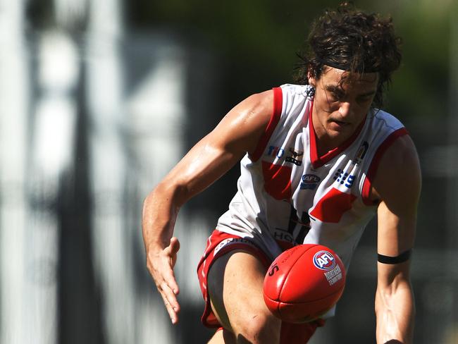 Waratah's Josh O'Brien closes in on a loose footy during Saturday's Div I Grand Final game against St.Mary's.