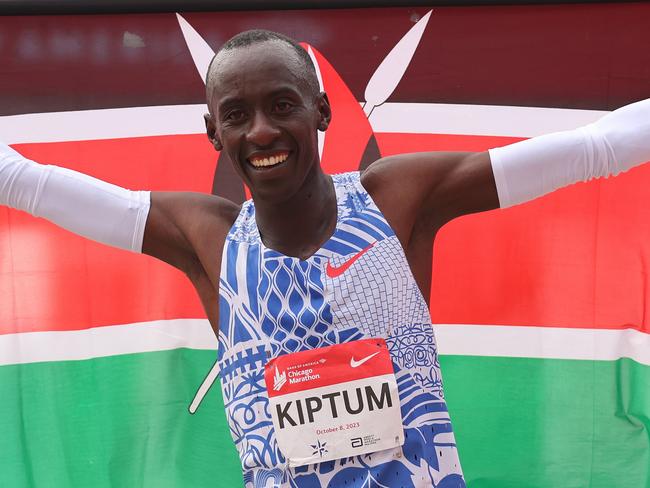 CHICAGO, ILLINOIS - OCTOBER 08: Kelvin Kiptum of Kenya celebrates after winning the 2023 Chicago Marathon professional men's division and setting a world record marathon time of 2:00.35 at Grant Park on October 08, 2023 in Chicago, Illinois. (Photo by Michael Reaves/Getty Images) *** BESTPIX ***