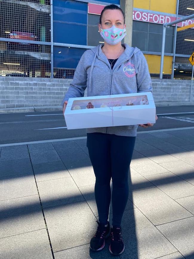 Kyla Daniels delivering cakes to staff at Gosford Hospital. Picture: Facebook