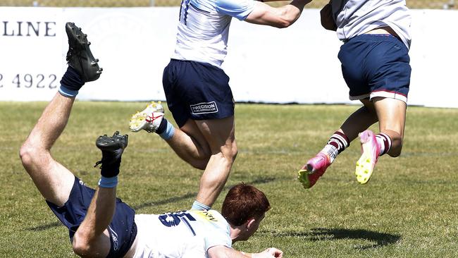 Queensland Reds' Dre-dyn Laban gets away from his Waratah pursuers. Picture: John Appleyard