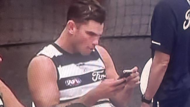 Tom Hawkins on his phone