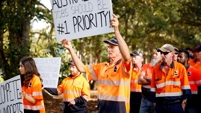 Heyfield Timber Mill workers held a silent rally outside state parliament to save their jobs. Picture: Chloe Smith.