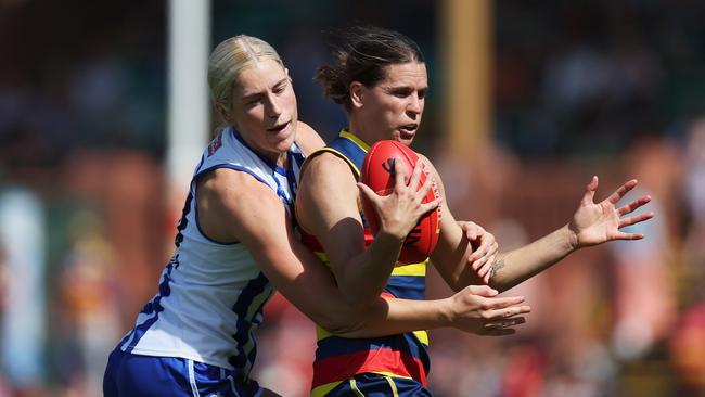 Kangaroos midfielder Jasmine Ferguson tackles Adelaide’s Chelsea Randall during the round 9 clash which the Crows won by three points at Norwood. Picture: James Elsby / Getty Images