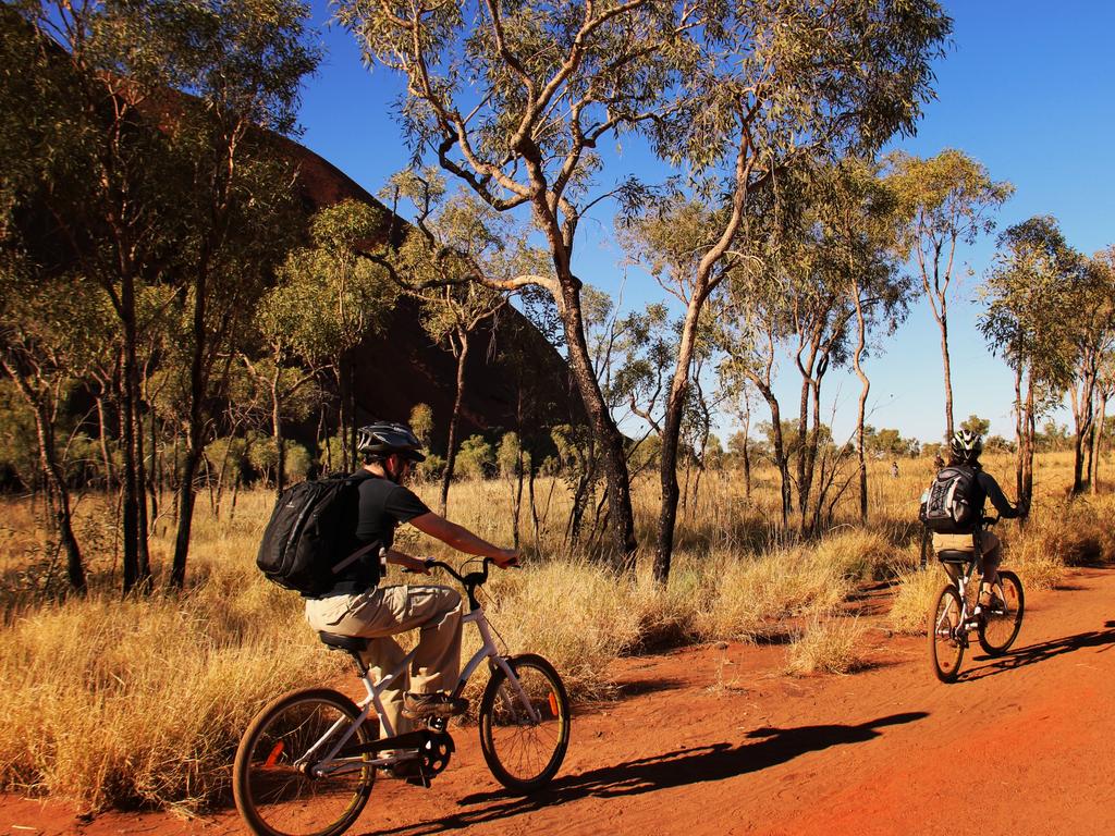 ESCAPE: Northern Territory, Sarah Nicholson -  Cycling - Uluru (Ayers Rock). Picture: Sarena Hyland/Tourism NT