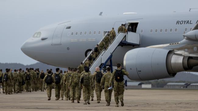 ADF personnel board an RAAF aircraft in Townsville bound for Afghanistan.