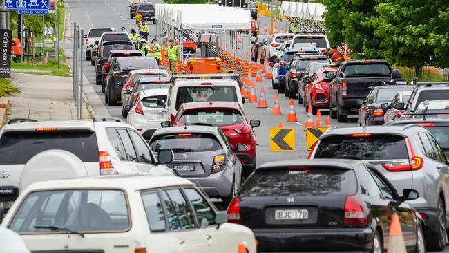 Police check NSW-bound travellers’ passes at the border checkpoint in Wodonga Place, Albury, on Monda. Picture: Simon Dallinger