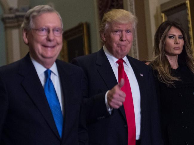 US President Donald Trump (C) walks with his wife Melania Trump, and Senate Majority Leader Mitch McConnell .  Picture:  AFP