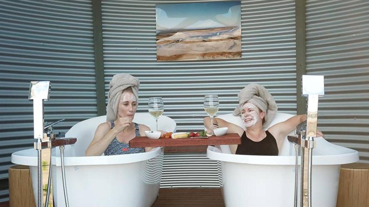 SOME of the visitors to the Julia Creek Caravan Park enjoy the experience of its new artesian water Bath Houses. Picture: supplied