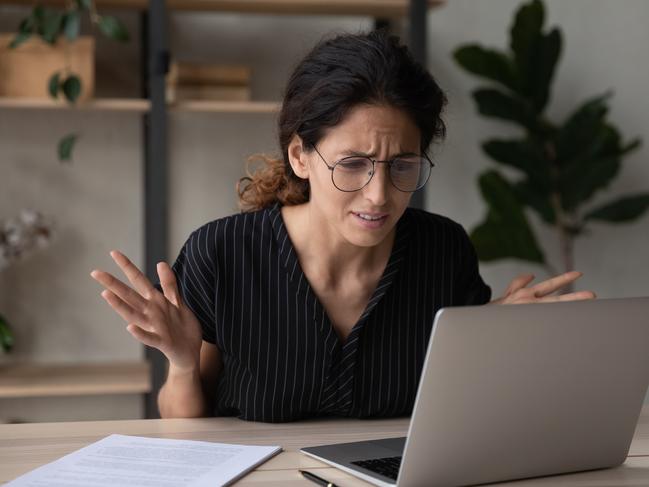 Close up upset businesswoman in glasses having problem with laptop, broken or discharged device, confused unhappy woman looking at computer screen, reading bad news, unexpected debt or spam