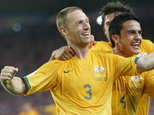 Socceroos Craig Moore, (L) jubilates with teammate Tim Cahill, (R) after scoring his sides first goal during the Croatia vs Aust Group /F soccer match at the World Cup Gottlieb-Daimler stadium in Stuttgart, Jun 22, 2006. (AP PicThomas/Kienzle) sport o/seas action