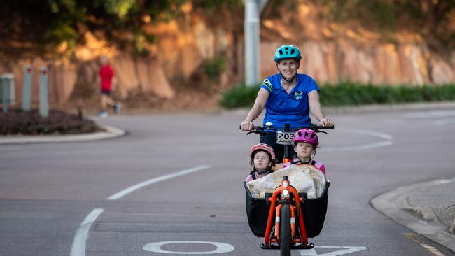 Camilla Wells with Pippa, Maggie and Molly crossing the finish line at the Top End Gran Fondo 2024. Picture: Pema Tamang Pakhrin