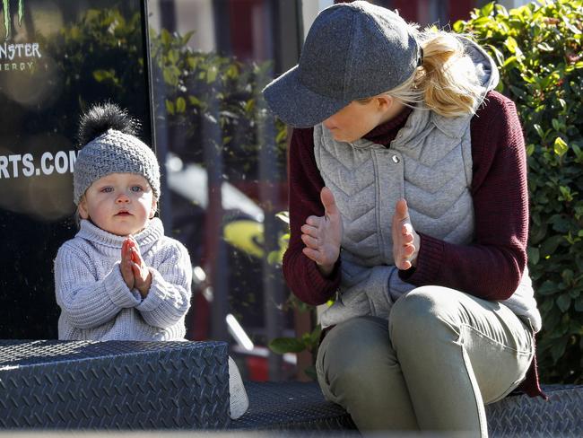 Carrie Bickmore claps along with one-year-old bub Evie.