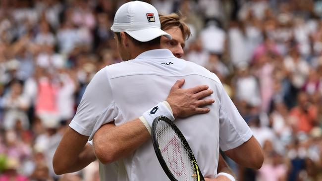 Kevin Anderson and John Isner embrace.