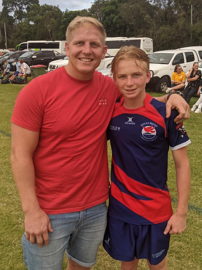 Five-time Origin champion Ben Hannant poses with son Kyle after his first match of rugby union. Picture: Nic Darveniza