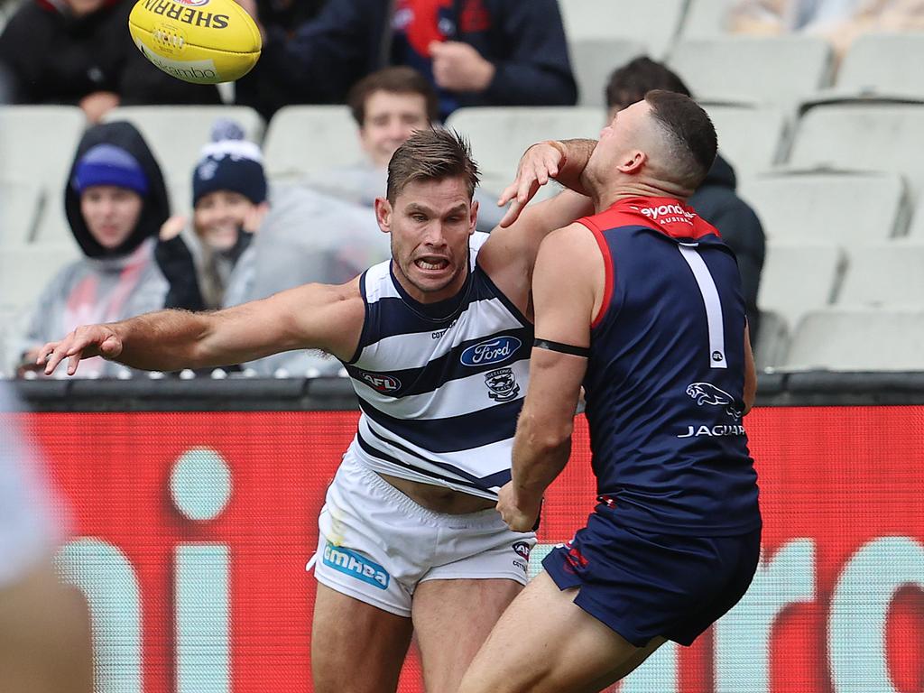 Tom Hawkins of the Cats collides with Steven May.