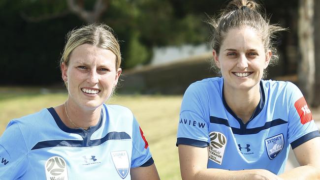 Sydney FC players Ally Green and Ellie Brush are urging fans to turn out in force at their January 16 game to help raise funds for bushfire and drought relief. Pic: John Appleyard.